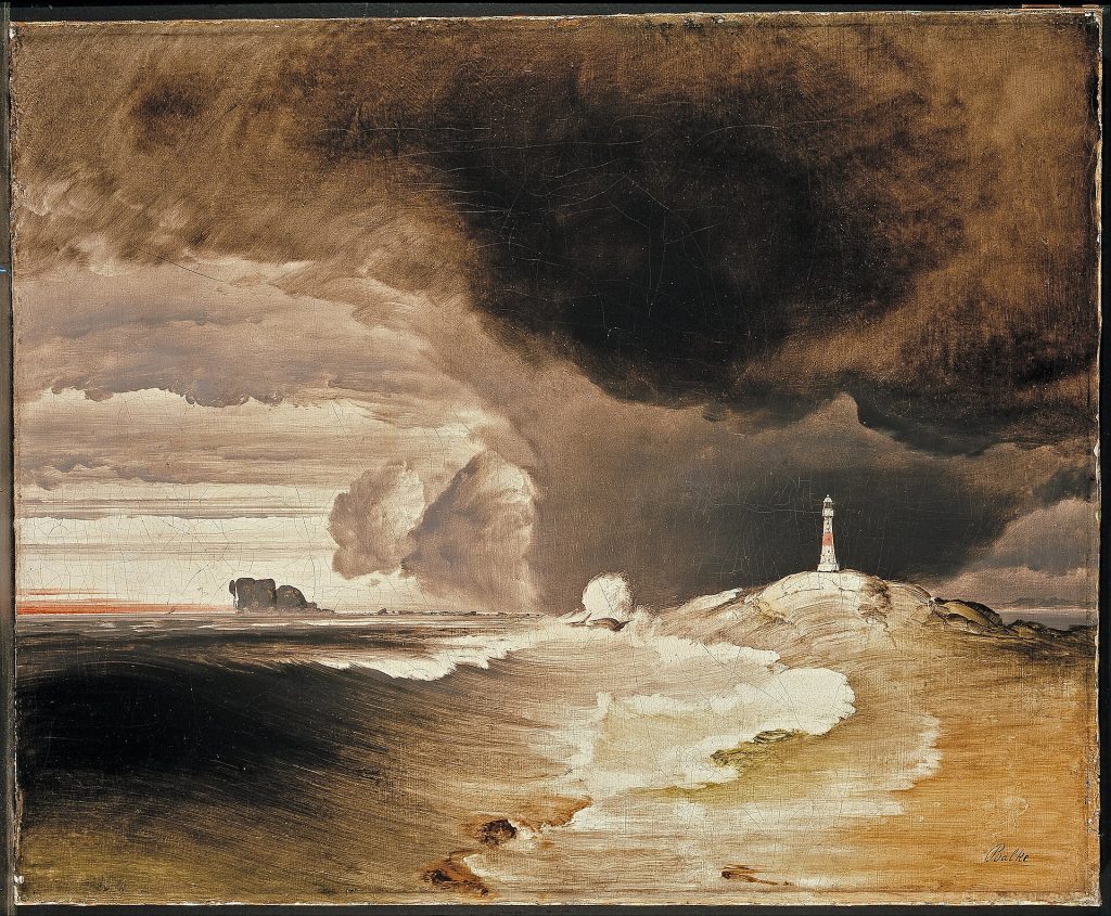 A small red-and-white lighthouse stands on a rocky headland while a dark storm fills most of the sky and heavy surf breaks along the shore.